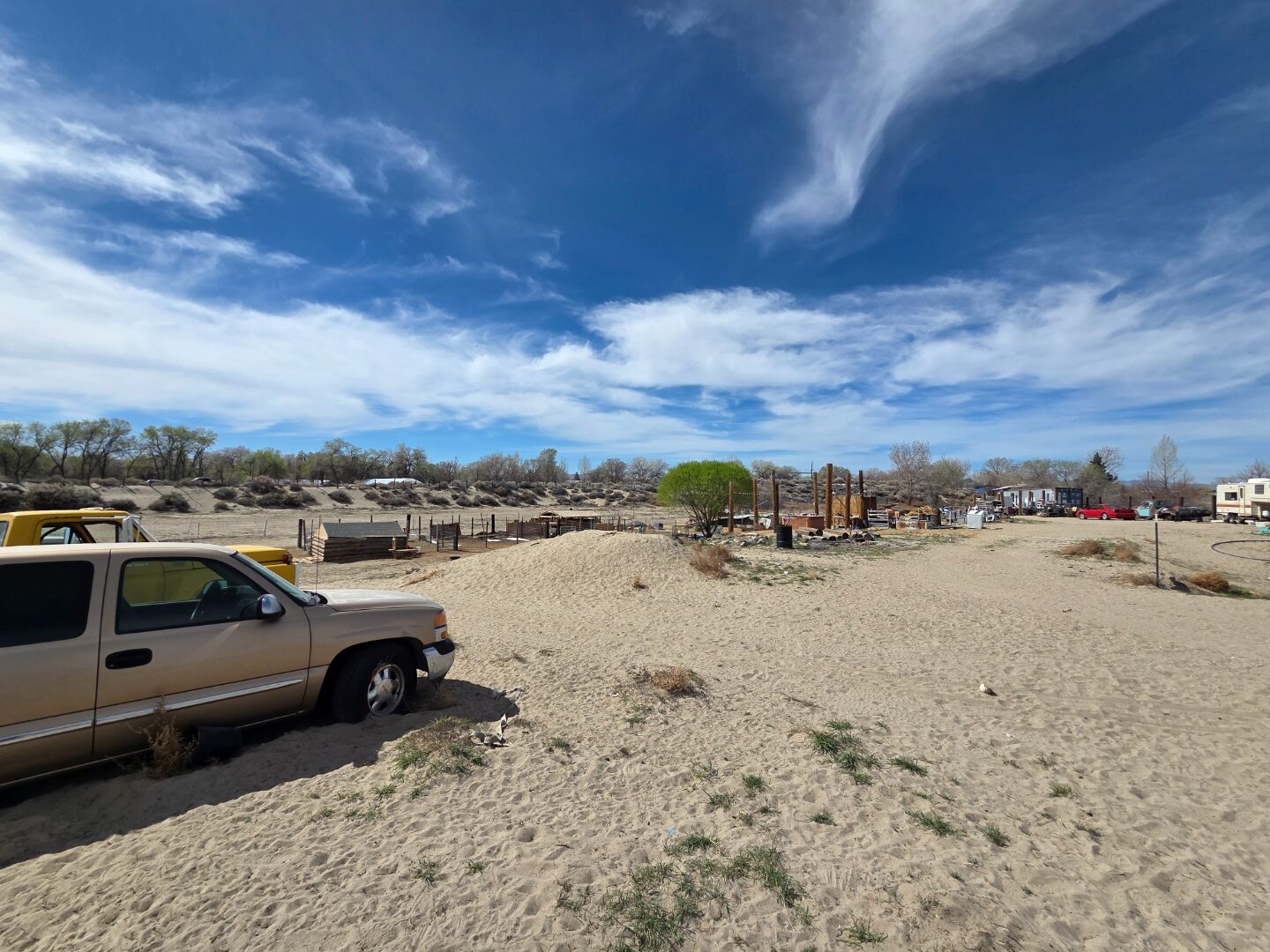 Property view showing gentle slope and desert terrain